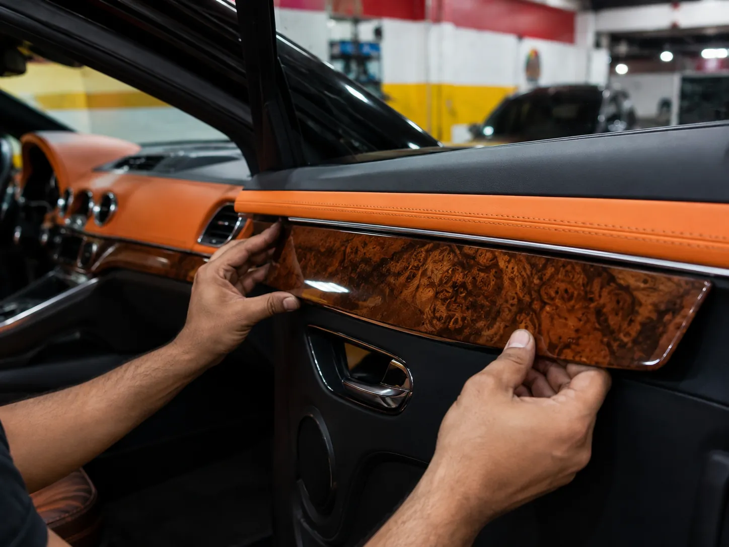 Technician installing wood-effect door trim