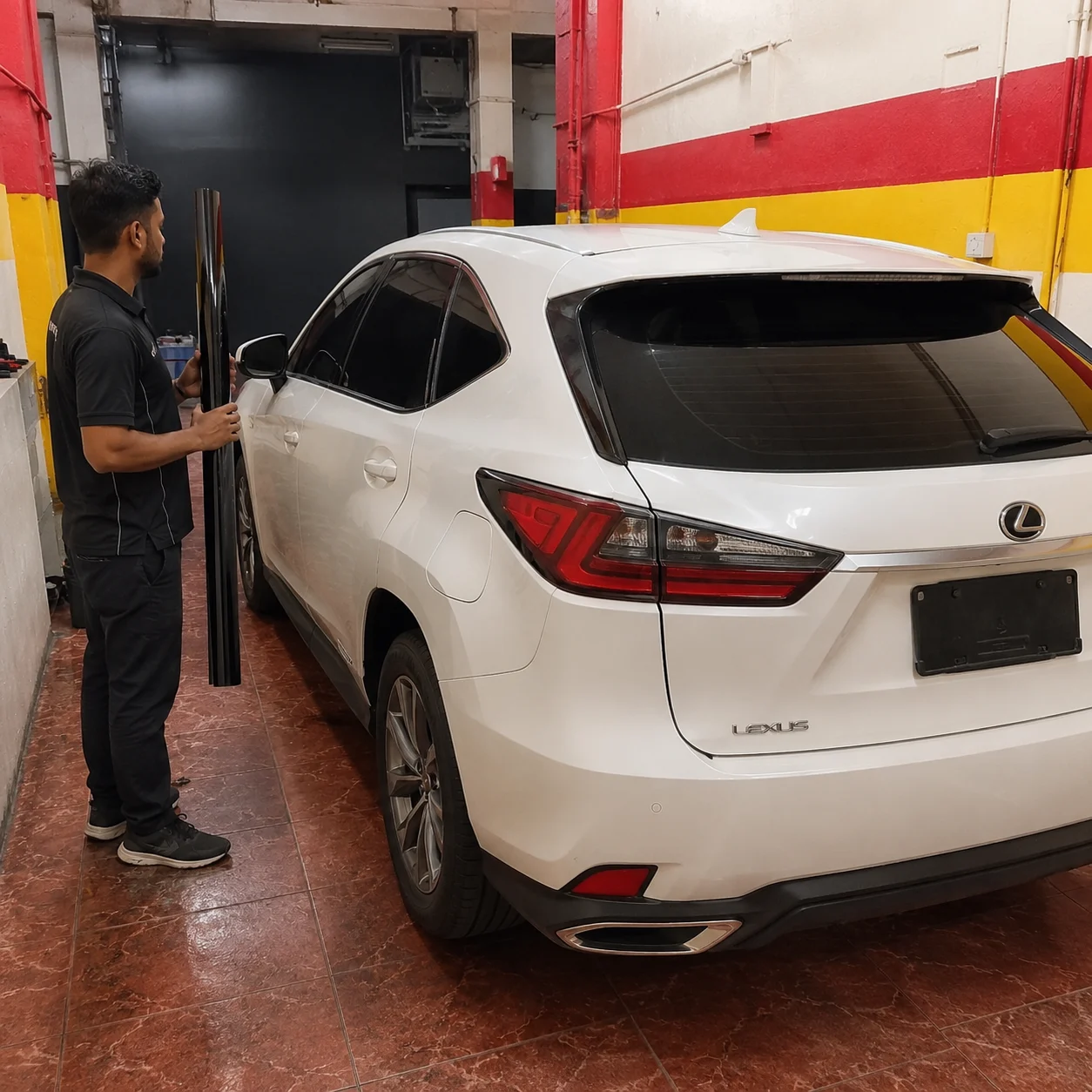 Window film installation on a white Lexus